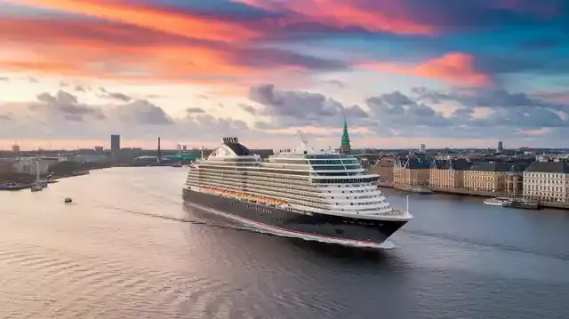 Copenhagen - Amsterdam Cruise 2025/2026 - Breathtaking view of a cruise ship sailing near cityscapes