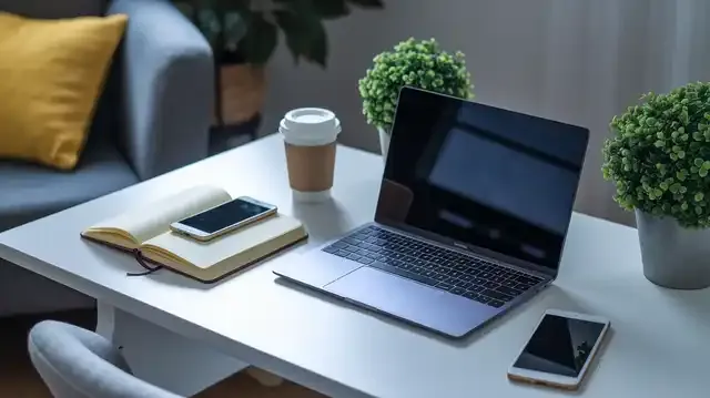 Remote Virtual Assistant Jobs - A workspace setup for virtual assistant work including a laptop and notebook on a desk