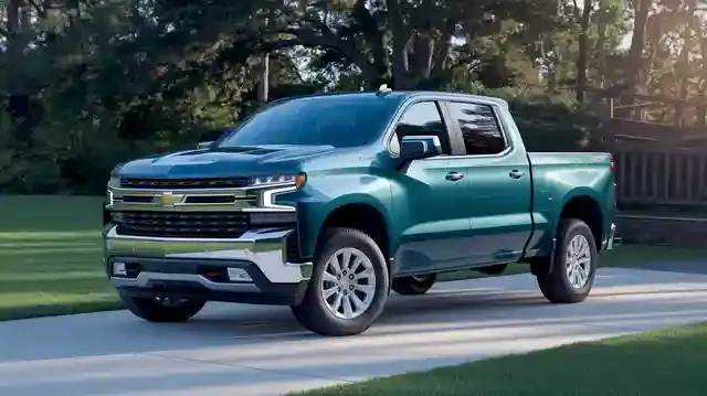 Second-hand Chevrolet Silverado - Used Chevrolet Silverado parked with green trees