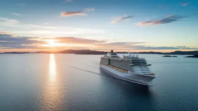 South Pacific Cruises From Melbourne - A cruise ship sailing towards islands at sunset