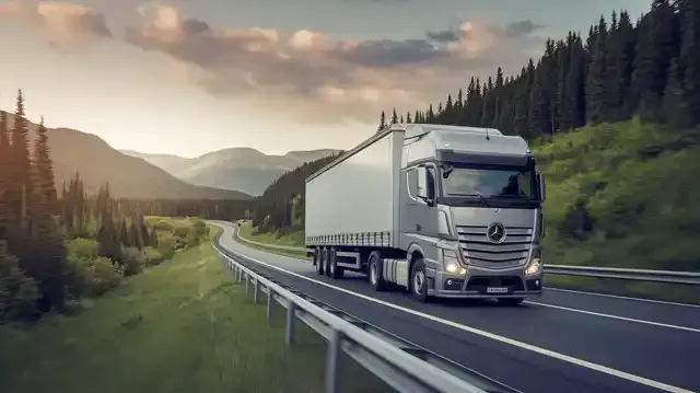 Truck Driving Jobs - Cargo truck driving through lush scenery